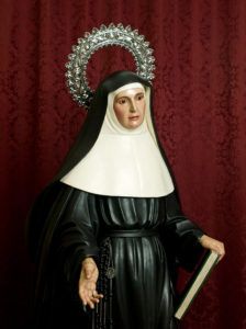 Santa Juana de Lestonnac tiende su mano derecha hacia el espectador